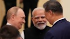 Indian Prime Minister Narendra Modi (centre) talks with Russian President Vladimir Putin and Chinese President Xi Jinping ahead of the Shanghai Co-operation Organisation summit in China.