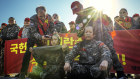 South Korean veteran marines shave their head in a protest outside the presidential office in Seoul this week.