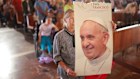 A faithful holds an image of Pope Francis during a mass for his passing at the Basilica of Guadalupe on April 21, 2025 in Mexico City. 