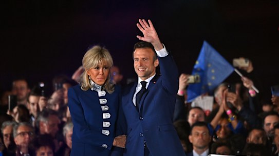 Tough job ahead. Emmanuelle Macron and wife Brigitte celebrate Sunday’s win.