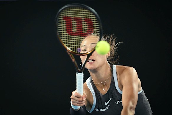 Qinwen Zheng has her eyes on the ball during her first-round match.