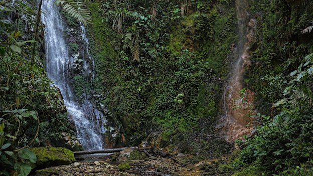 Locals believe drilling by mining companies has polluted one of two parallel waterfalls known as “The Twins”. The polluted waterfall (right) is now reduced to a trickle.