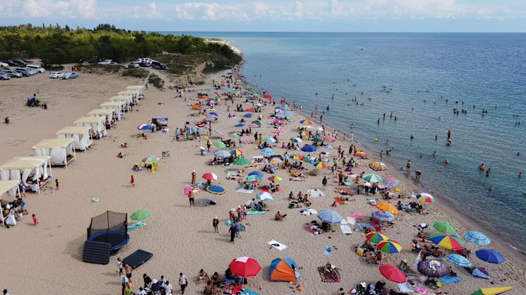 Kyrgyzstan's Issyk-Kul Lake Draws Beachgoers Despite Alpine Setting