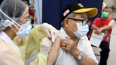 A health worker administers a dose of vaccine in Taipei, Taiwan.