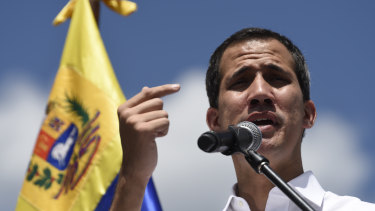 Juan Guaido, president of the National Assembly who swore himself in as the leader of Venezuela, speaks during a meeting of aid volunteers in Caracas, Venezuela, on Saturday.