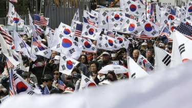 Supporters of former South Korean President Park Geun-hye stage a rally to call for her release earlier on Friday.