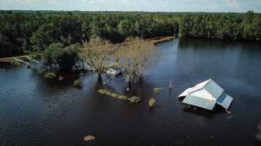 A flooded farm stands next to the Lumber River in this aerial photograph taken after Hurricane Florence hit Lumberton, North Carolina.