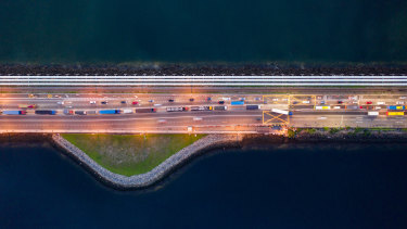 Vehicles travel along the Causeway across the Strait of Johor between Singapore and Malaysia.