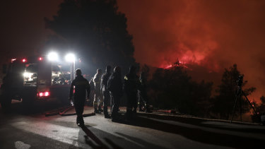 Hundreds of firefighters battled wildfires in Greece on Tuesday, with the largest burning out of control through a thickly forested nature reserve on the island of Evia.