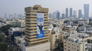 An election campaign banner for Benjamin Netanyahu adorns an apartment building in Tel Aviv. 