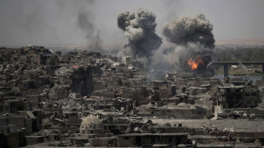 Airstrikes target Islamic State positions on the edge of the Old City in Mosul.