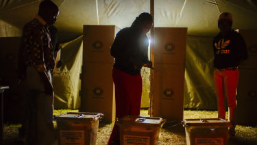 Voters cast their ballots at a polling station in the Mbare township, Harare.