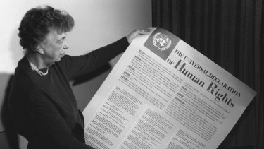 Eleanor Roosevelt holds the Universal Declaration of Human Rights.