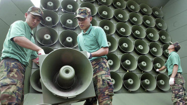 South Korean army soldiers remove loudspeakers used for propaganda near the demilitarized zone between South and North Korea.