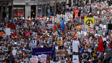 Demonstrators march along Regent Street during a protest against U.S. President Donald Trump in central London on Friday.