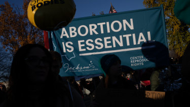 Pro-choice demonstrators protest outside the US Supreme Court at the start of one of the most significant abortion rights cases in decades. 