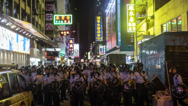 Riot police stand off against demonstrators during the protest.