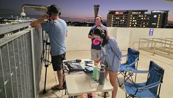 Julia Flights streaming the arrival in Brisbane of Canadian rapper Drake from atop the domestic terminal car park.