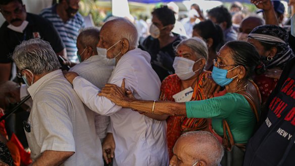 Elderly Indians queue at a vaccination centre in Mumbai.