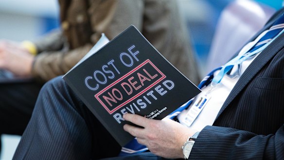 A delegate reads a pro-Brexit document during the Conservative Party annual conference in Birmingham.