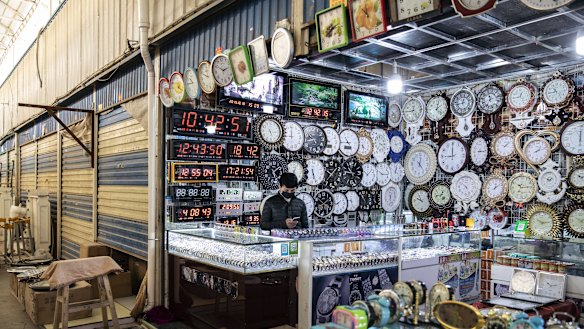 Clocks are displayed at a stall inside the main bazaar Xinjiang.