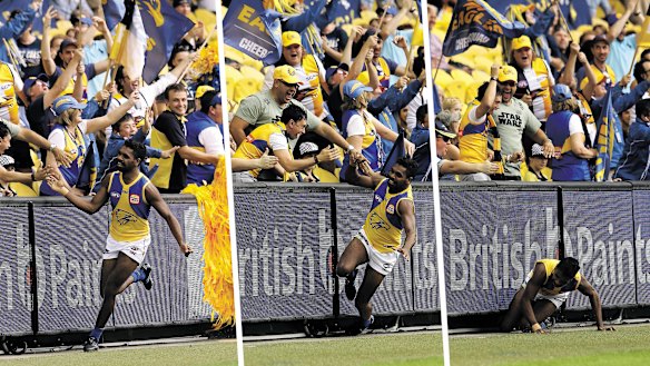 Oops: West Coast's Liam Ryan celebrates his goal, and then slips. 