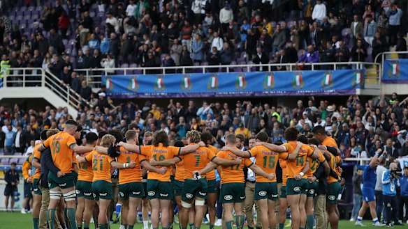 The Wallabies gather in a circle after losing to Italy in Florence.