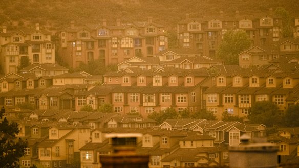 Smoke fills the air over homes in Oakland, California.