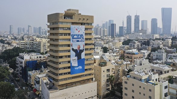 An election campaign banner for Benjamin Netanyahu adorns an apartment building in Tel Aviv. 