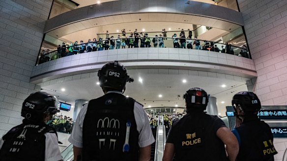Hong Kong police face off against protesters in a shopping centre in April this year.