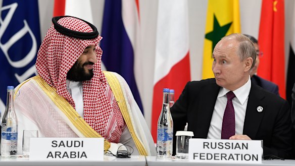 Saudi Arabia's Crown Prince Mohammed bin Salman, left, talks with Russian President Vladimir Putin, right, during the G-20 summit in Osaka, Japan, last year.
