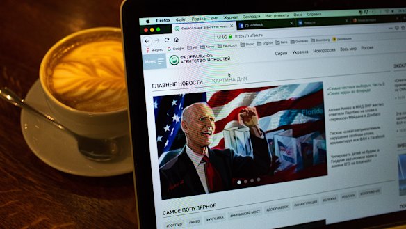 The website of the Federal Agency of News (FAN) is displayed on a laptop in Moscow. The website has accused Facebook of censorship for shutting down its account.