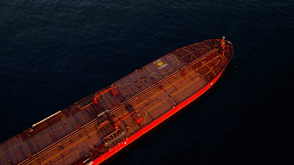Oil tankers are seen anchored in the Pacific Ocean carrying crude oil no one will buy.