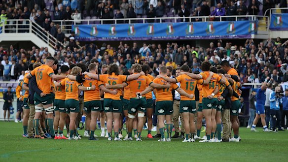 The Wallabies gather in a circle after losing to Italy in Florence.
