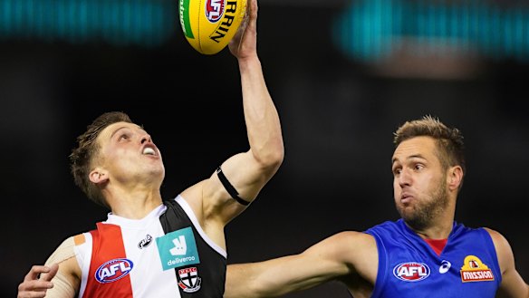 Gathering speed: St Kilda's Jack Billings controls the ball as Bulldog Matthew Suckling applies pressure.