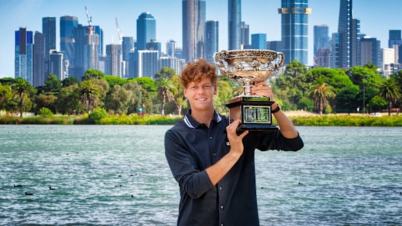 Jannik Sinner poses with the Norman Brookes Challenge Cup after winning the Australian Open men’s singles title.