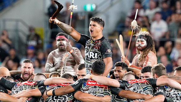 Latrell Mitchell at the centre of the Indigenous All Stars war cry prior to their clash with the Maori.