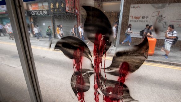 A black version of the five-petal Hong Kong Bauhinia, which features on the Hong Kong flag, is displayed on the street the morning after clashes.