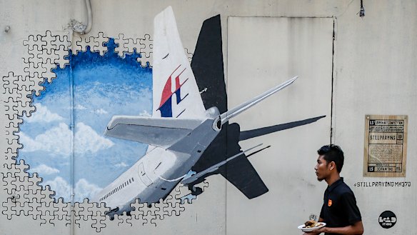 A mural for MH370. Malaysia's transport minister says the private search for the missing plane will end next week.
