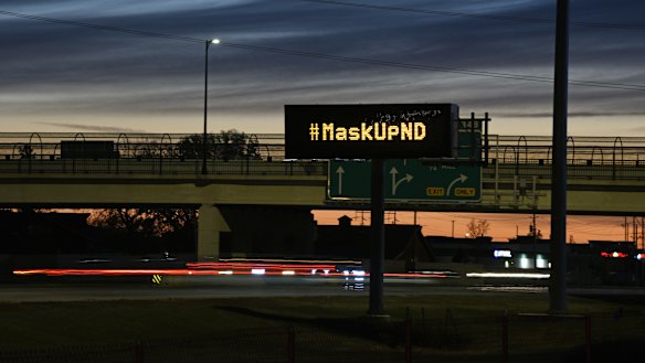 A sign in Fargo this month encouraging drivers to wear a mask. On Monday, the mayor used his emergency powers to issue a mandatory mask order.
