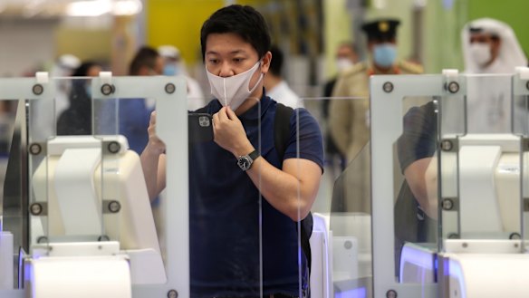 A Japanese journalist checks out the new face and iris-recognition procedures, during a media tour at Dubai airport, United Arab Emirates. 
