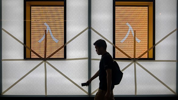 Tape fixed to window panes during preparations ahead of Super Typhoon Mangkhut's arrival at Causeway Bay Hong Kong, China, on Saturday.