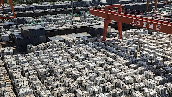Bundles of aluminum ingots sit stacked at a China National Materials Storage and Transportation Corp. stockyard in Wuxi, China.