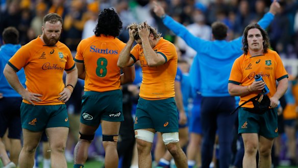 Wallabies players after their one-point defeat to Italy.