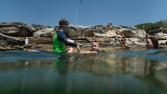 Iggy Wiseman, 7, and brother Jet, 5 (in green), at Mahon Pool.