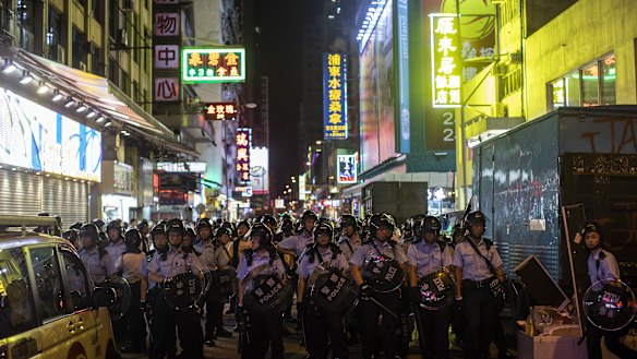 Riot police stand off against demonstrators during the protest.