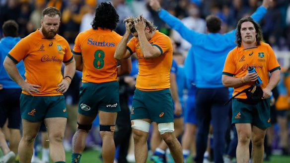 Wallabies players after their one-point defeat to Italy.