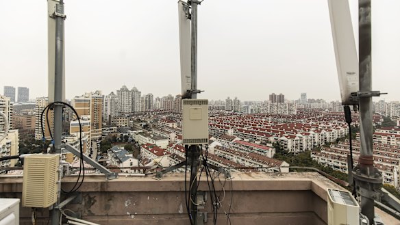 Huawei signal-transmission equipment stands on a building rooftop in Shanghai. China's largest technology company denies committing the alleged charges.
