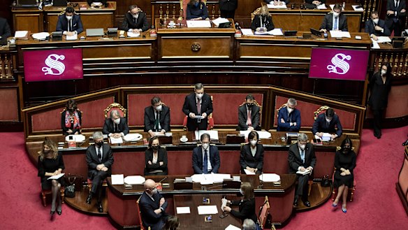 Prime Minister Mario Draghi, centre, delivers his first speech in the Senate.