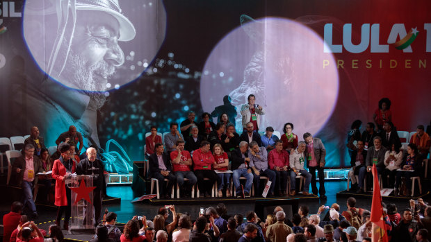 Members of the Workers' Party sit on stage during the party's national convention in Sao Paulo, on Saturday.
